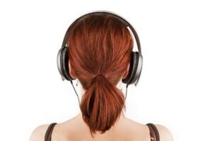 headphones-woman-shutterstock